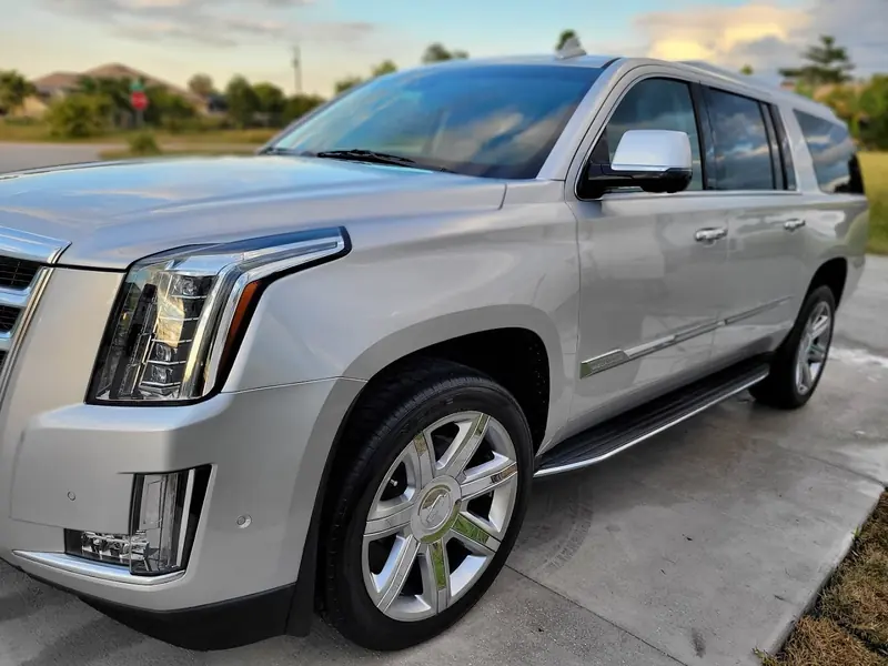 Silver Cadillac Escalade, clean and shining